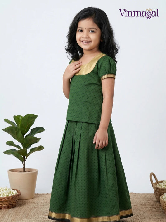 Girls wearing pure cotton green pavadai sattai with matching blouse – traditional festive outfit