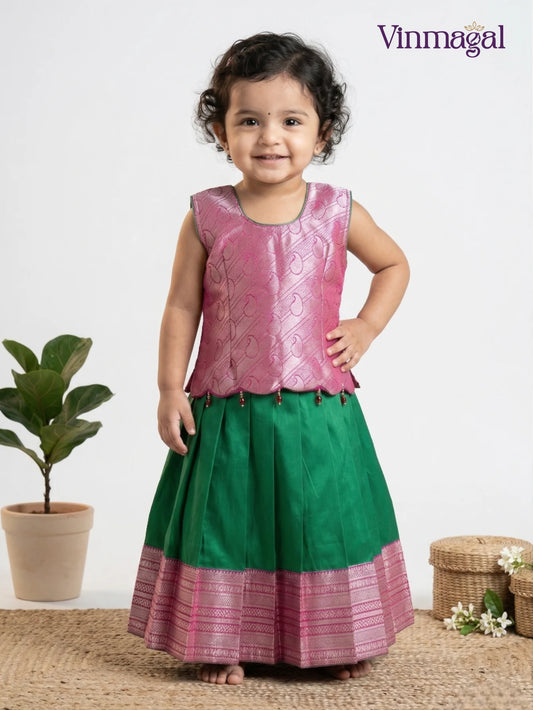 Green and pink soft silk pattu pavadai for girls – traditional South Indian ethnic festive dress for kids with classic border work