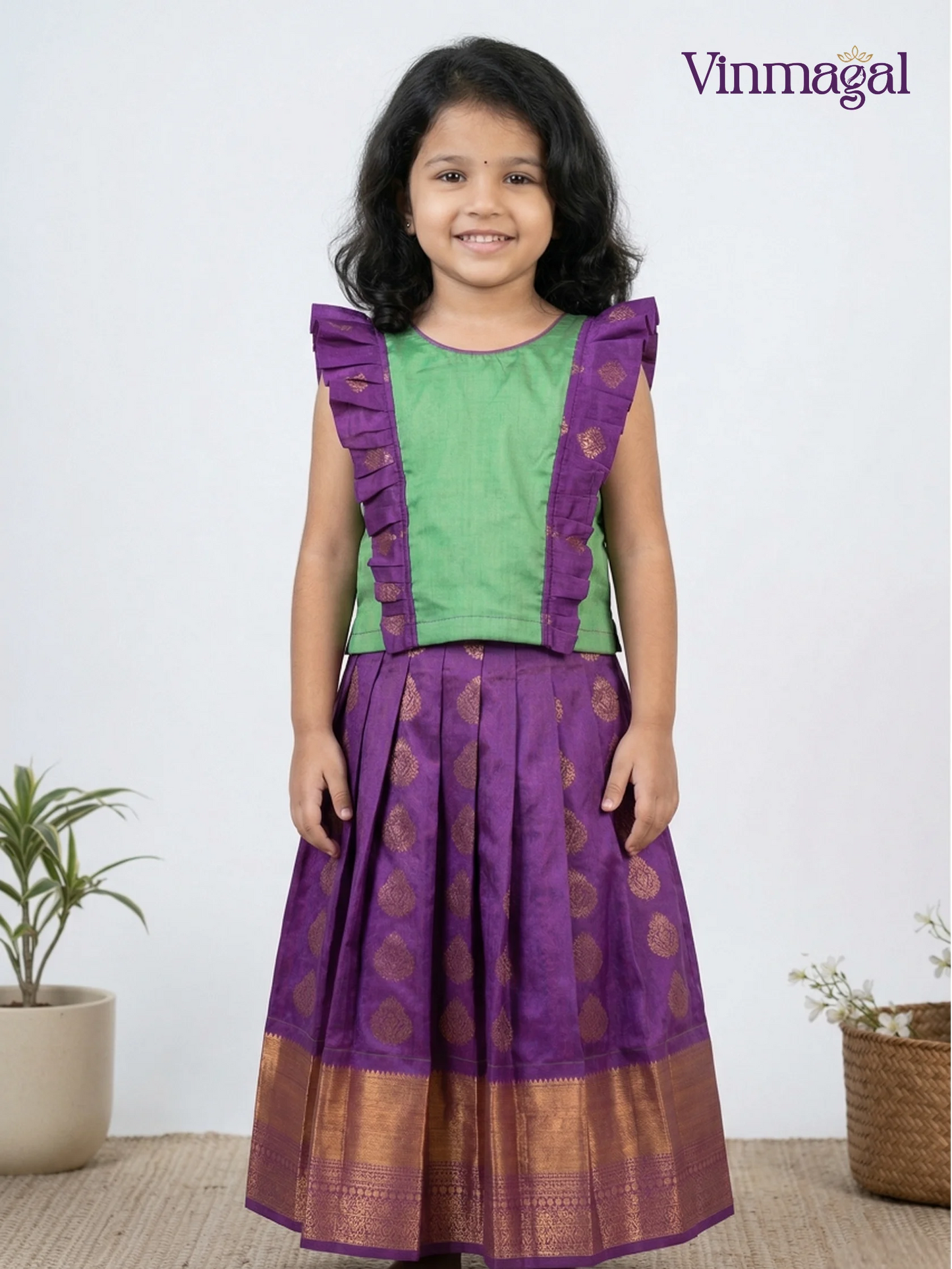 Green and purple silk pavadai for girls – traditional ethnic festive wear for kids
