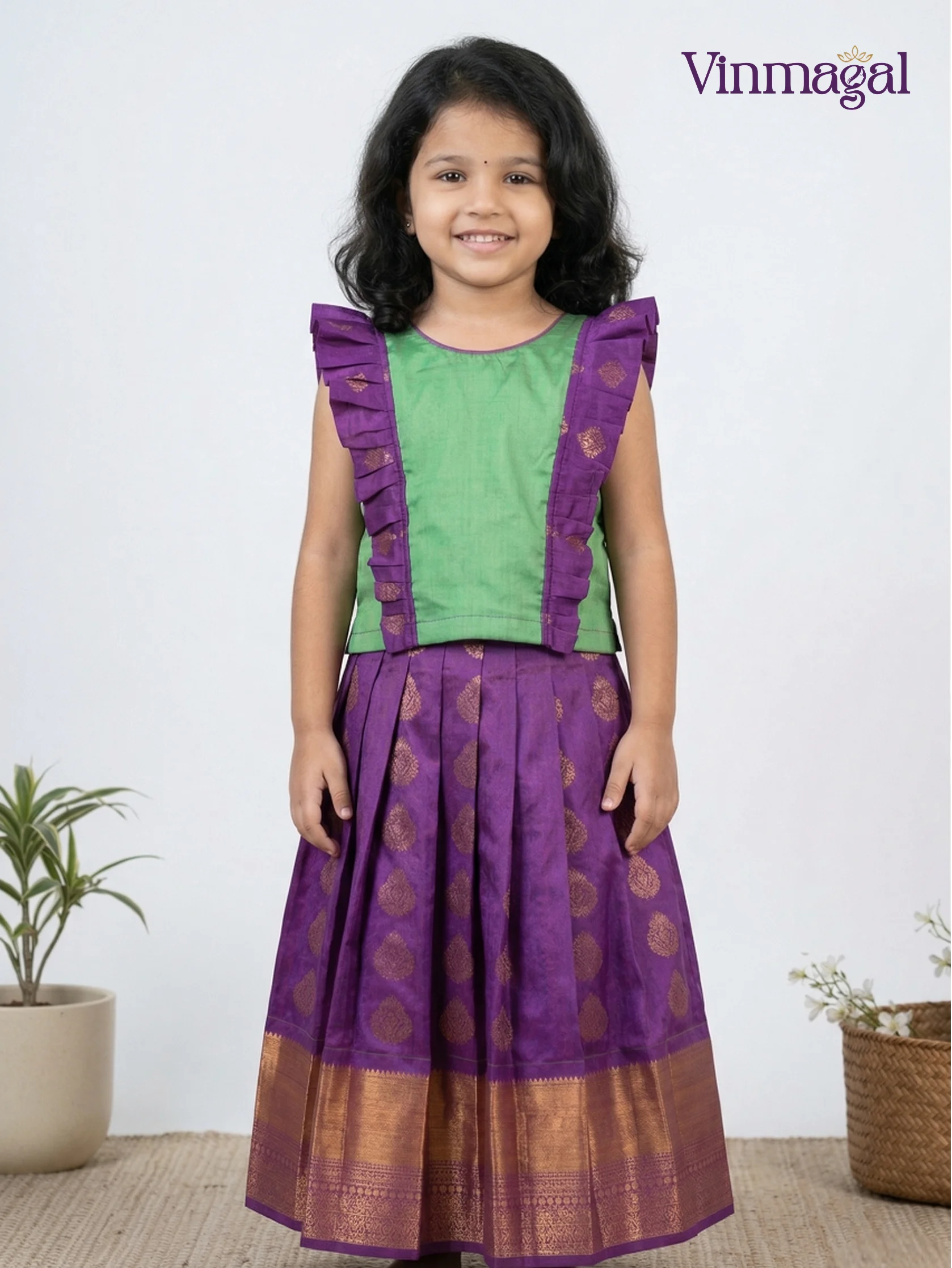 Green and purple silk pavadai for girls – traditional ethnic festive wear for kids