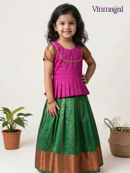 Pink and green pure Kanchipuram pattu pavadai for girls – authentic handwoven traditional silk dress for kids with real zari border detailing