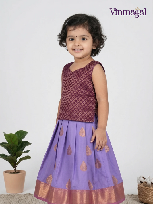 Purple and magenta soft silk pattu pavadai for girls – vibrant traditional South Indian festive dress for kids with border detail