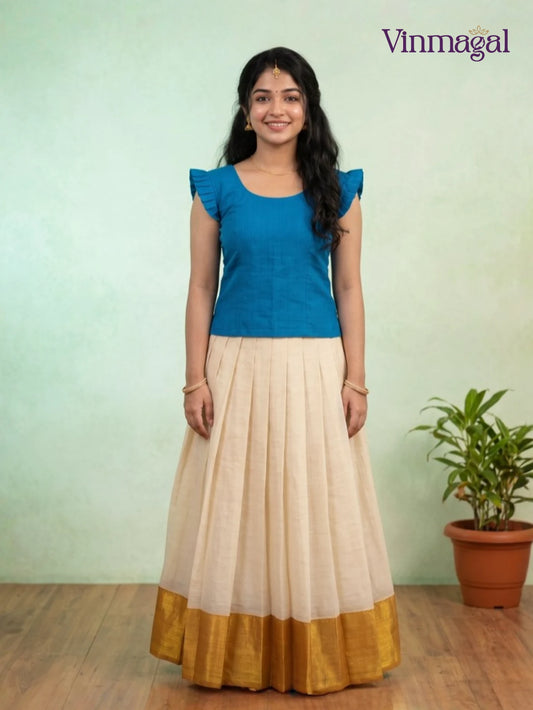 blue and golden white kerala pattu pavadai for girls suitable for festive wear