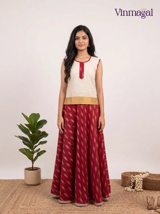 cream white top with maroon pattu pavadai for girls in festive traditional style