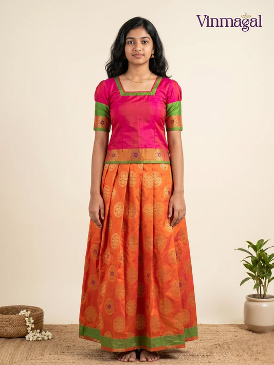 dark pink butter silk blouse with pink floral banarasi semi silk pavadai set for girls