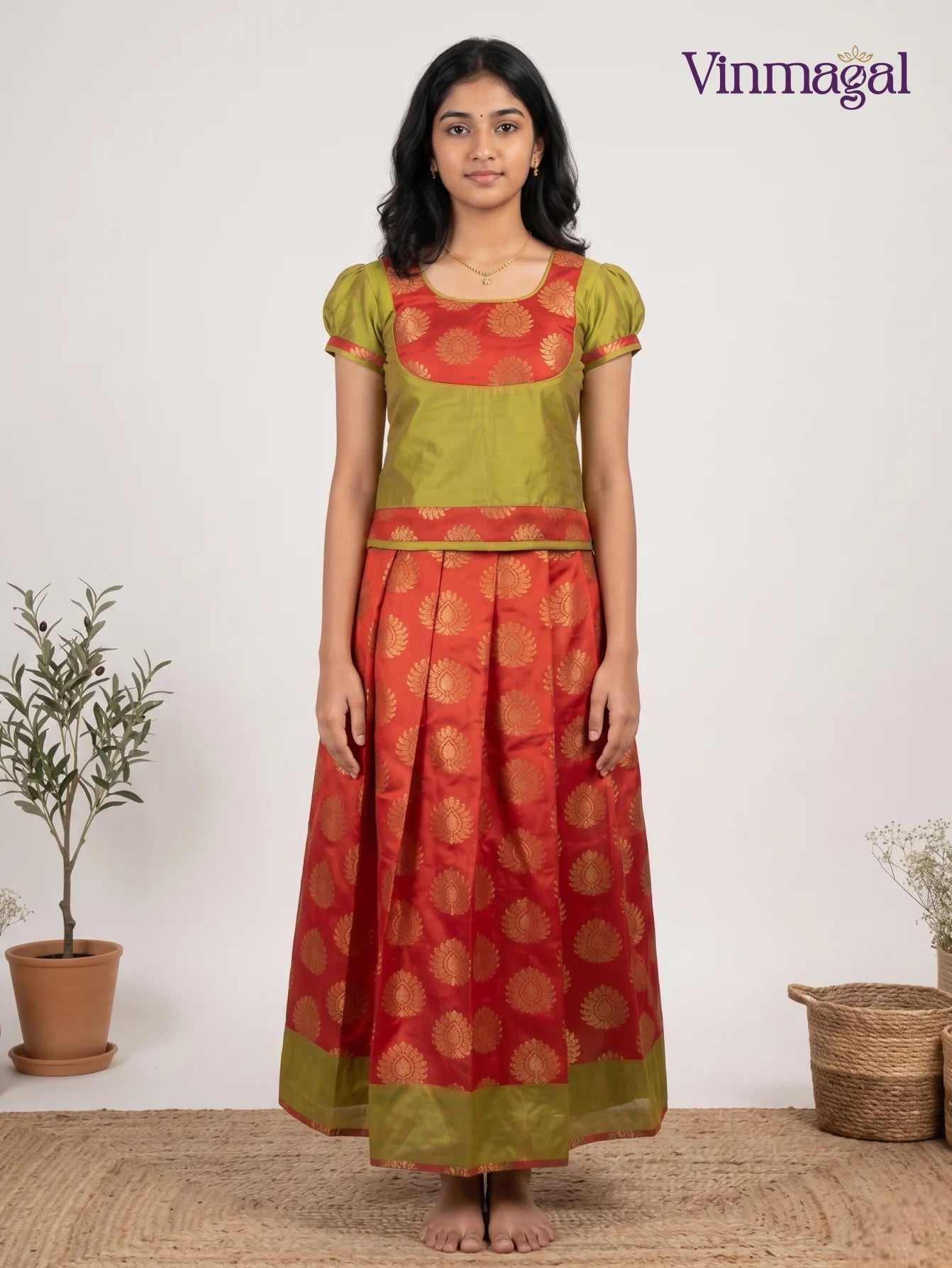 green butter silk blouse with floral banarasi semi silk pattu pavadai set for girls