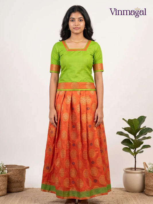 green orange butter silk blouse with banarasi semi silk pattu pavadai set for girls
