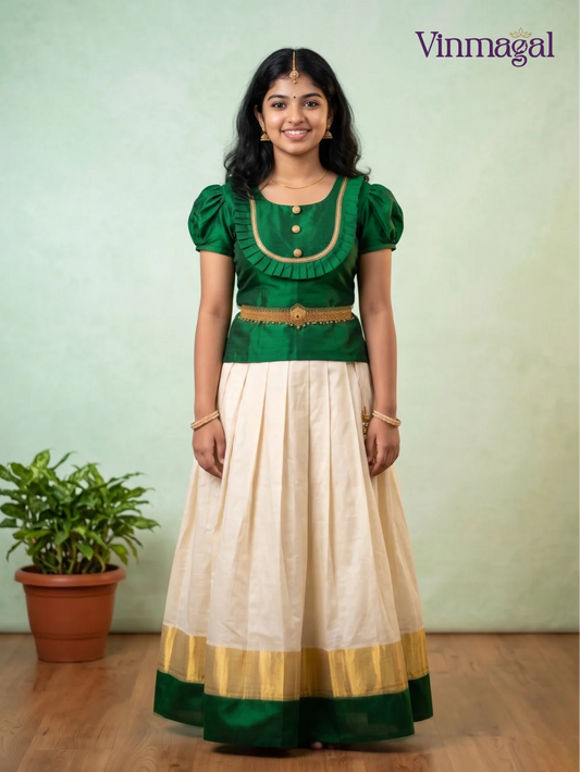 Green top and cream Kerala pattu pavadai with gold and green border for girls traditional South Indian ethnic outfit for Onam Vishu weddings and festive occasions
