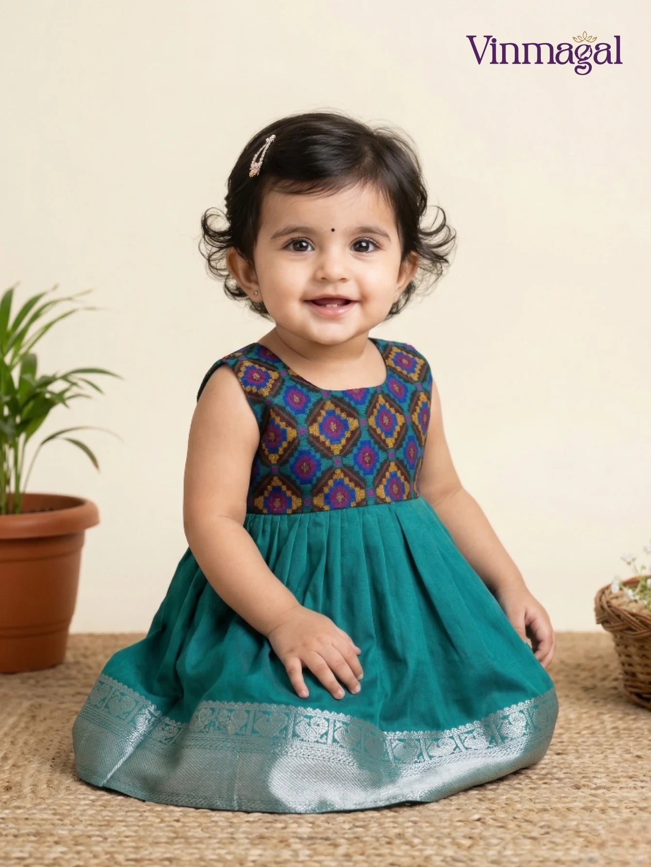 green kids frock with silver zari border designed for festive occasions