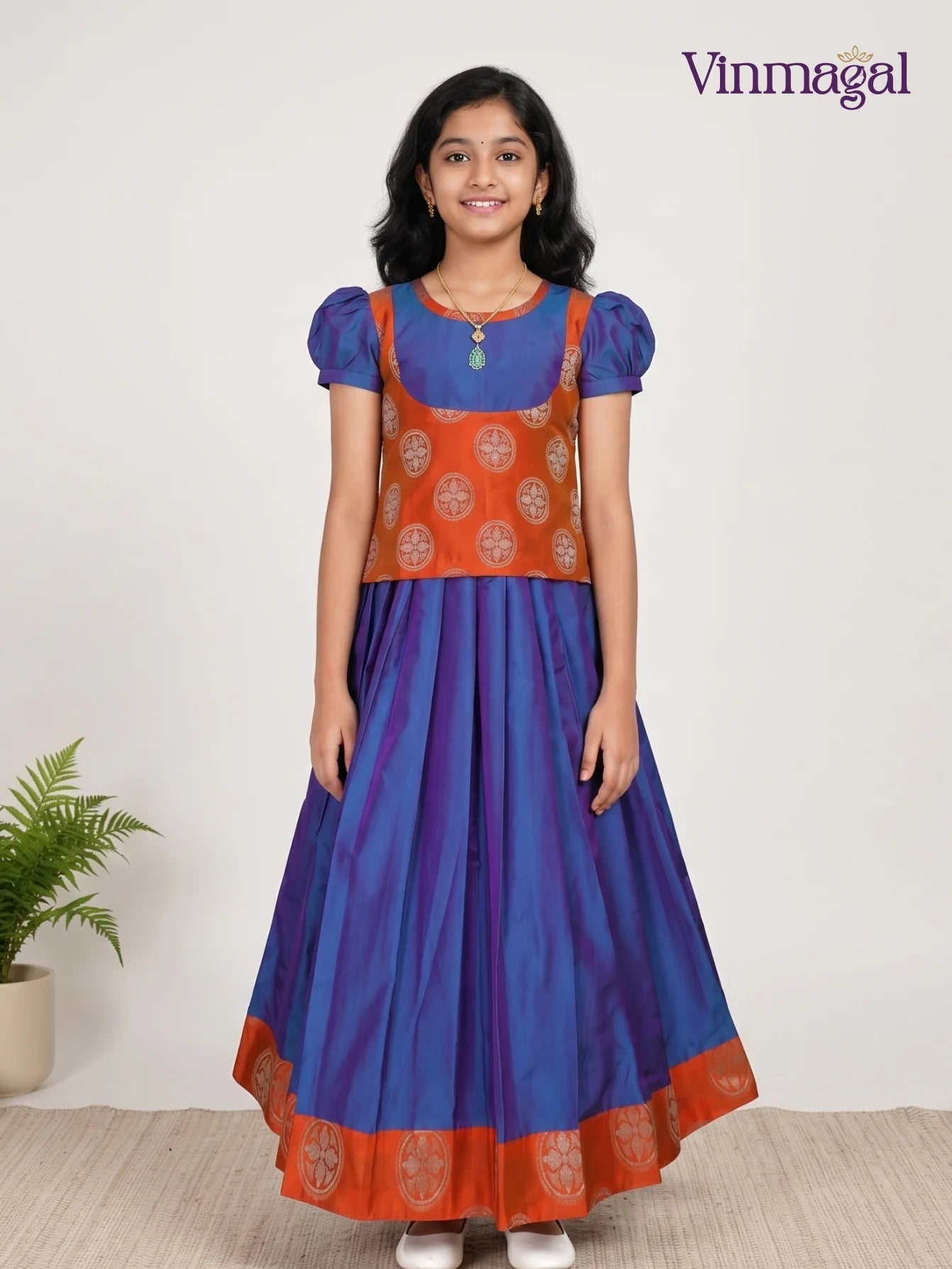 indigo blue and orange pattu pavadai for girls traditional dress
