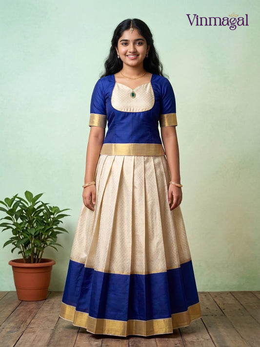 dark blue top with golden white kerala pattu pavadai featuring golden border for girls