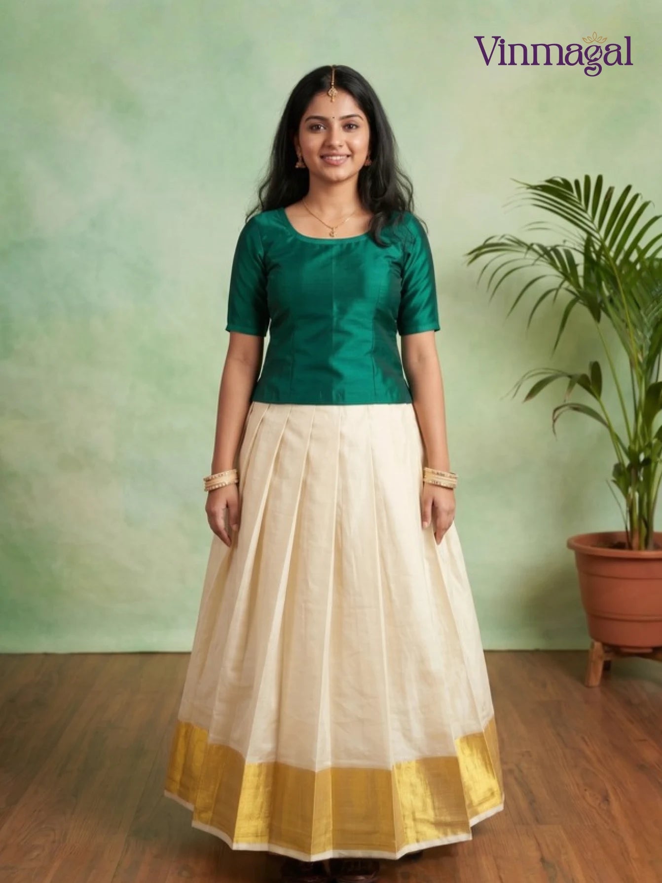 dark green top with cream white kerala pattu pavadai featuring golden border for girls