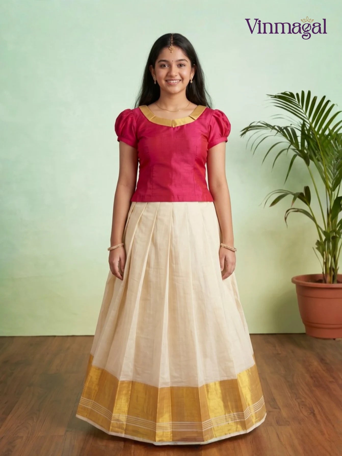 dark pink puff sleeve top with cream white kerala pattu pavadai featuring golden border for girls
