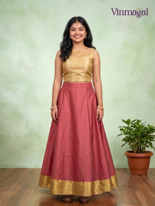 golden top with pink kerala pattu pavadai for girls