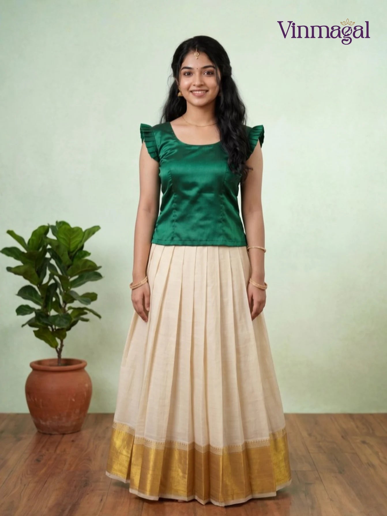 deep green and cream white kerala pattu pavadai for girls festive wear