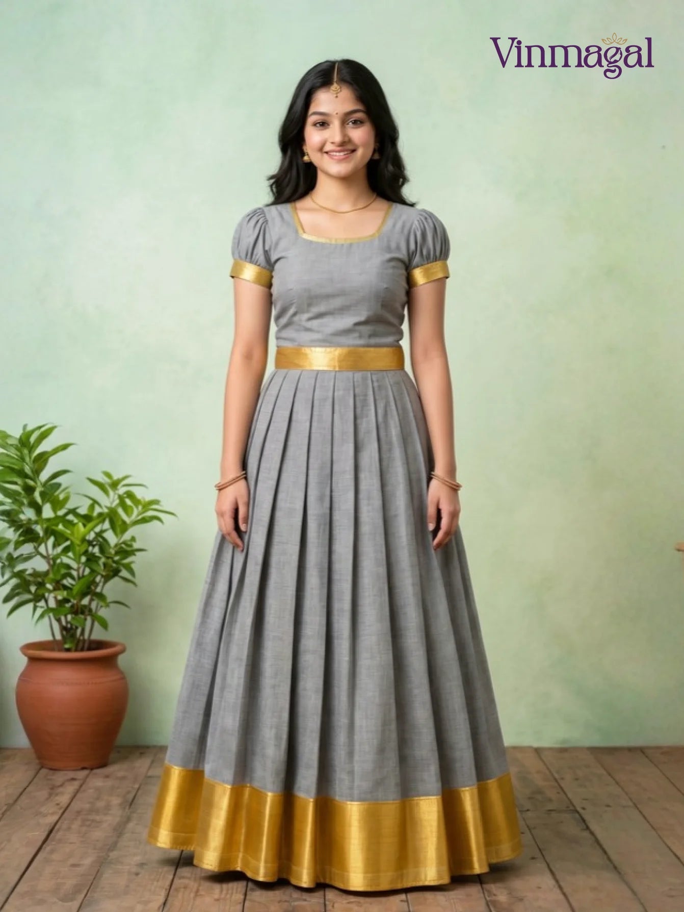 grey kerala pattu pavadai with golden border for girls
