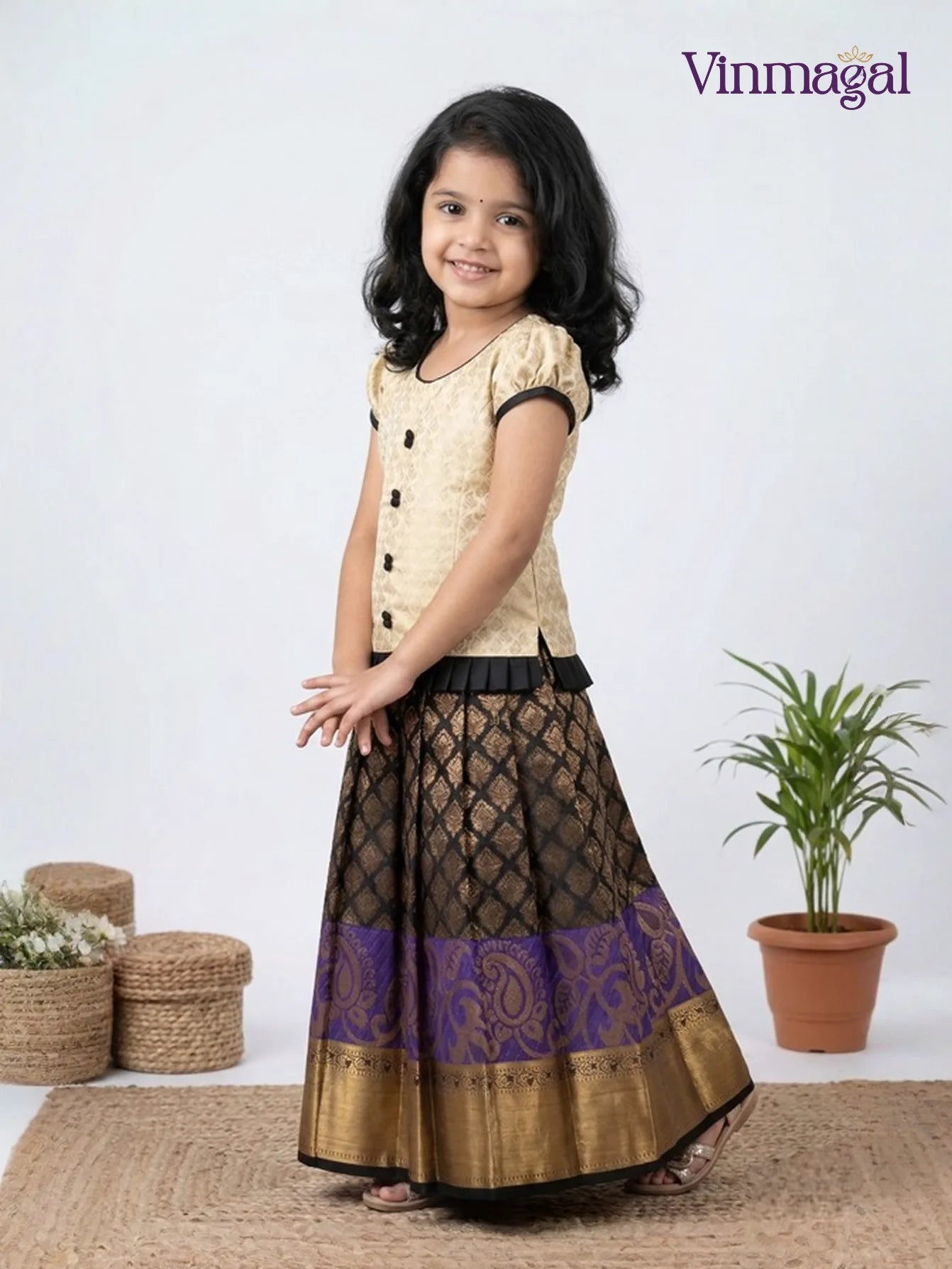 Kids cream and black pattu pavadai set with golden zari skirt and beadwork blouse