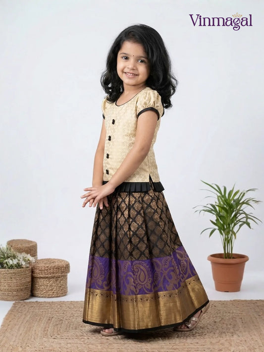 Kids cream and black pattu pavadai set with golden zari skirt and beadwork blouse