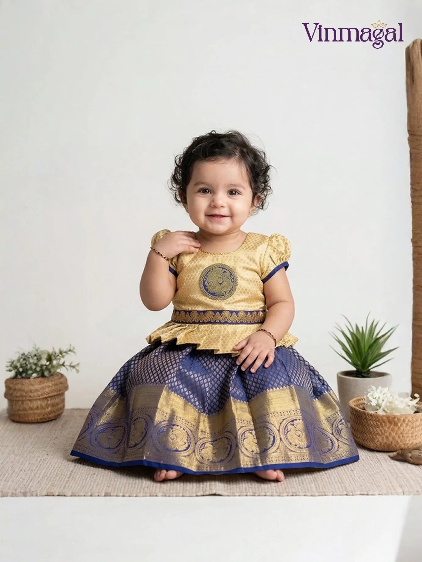 Kids pure silk pavadai set in navy blue and cream with puff sleeve top and zari border skirt