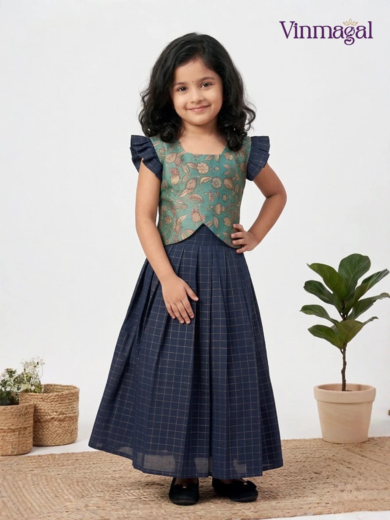 navy blue raw silk pavadai sattai for girls in traditional skirt and blouse set