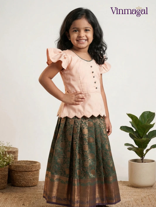 Peach and peacock green art silk pavadai skirt set for girls – traditional South Indian ethnic wear for kids with classic border detailing