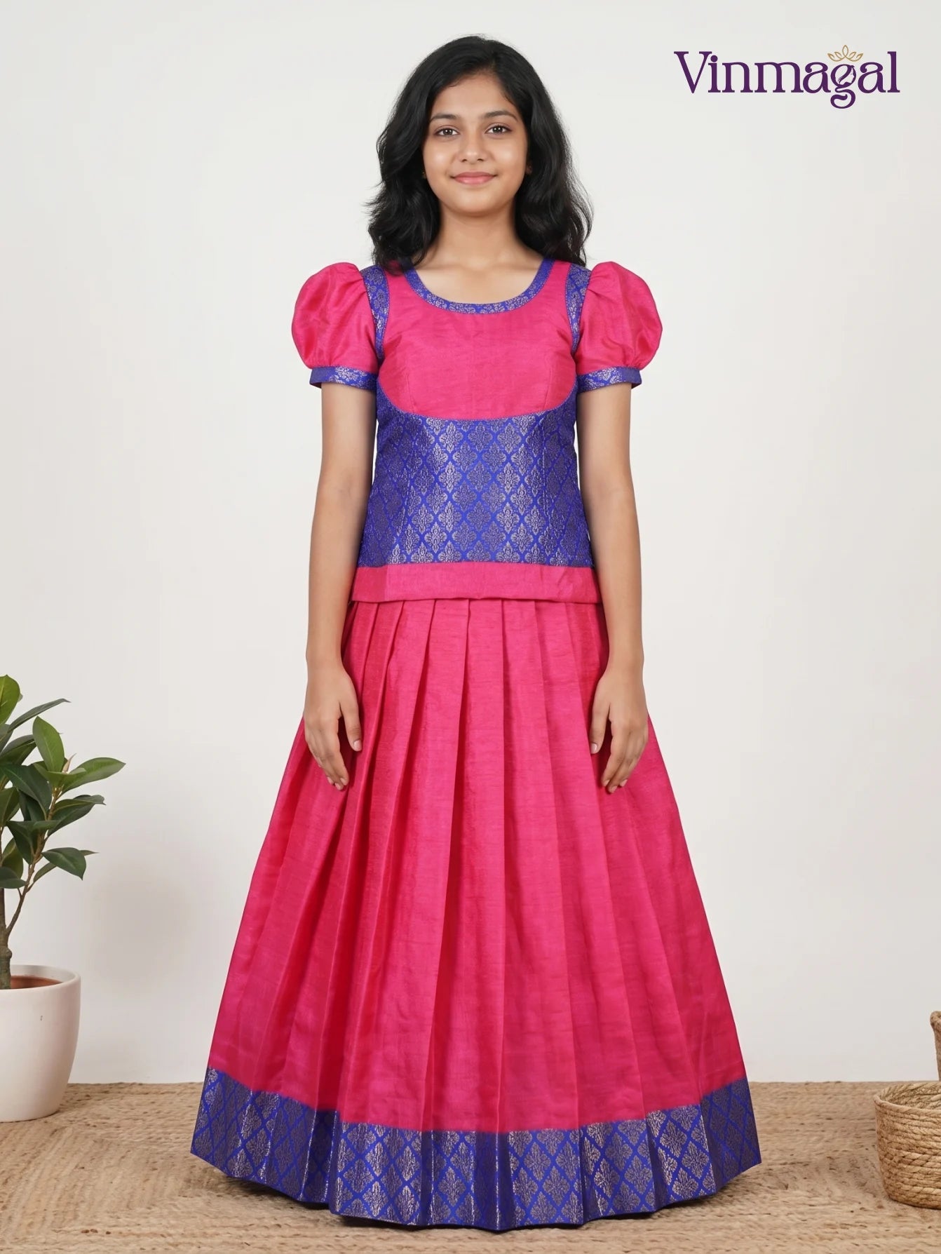 pink and blue pattern pattu pavadai for girls traditional dress