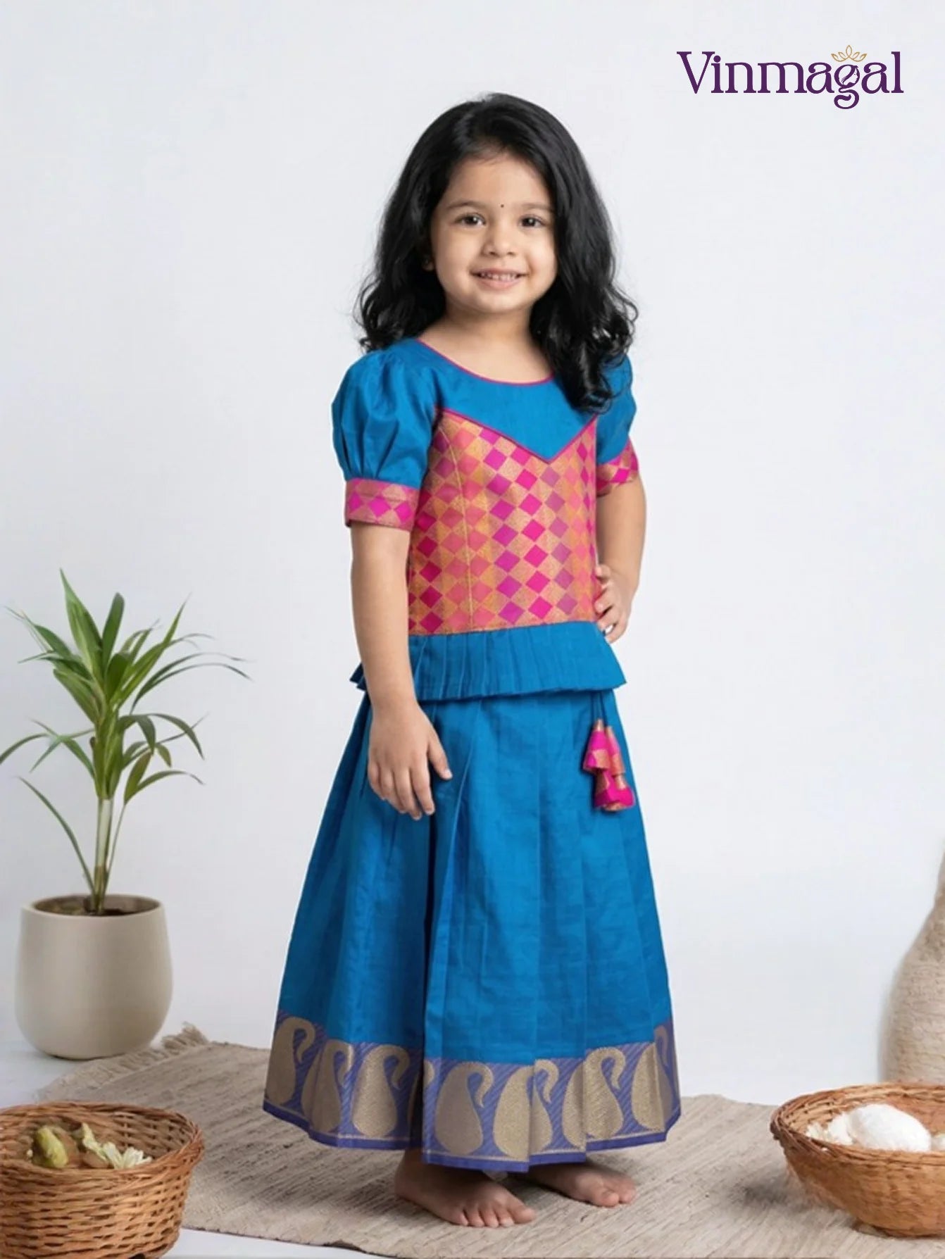 Pink and peacock blue pure silk pavadai set for girls with silver zari skirt and peplum top