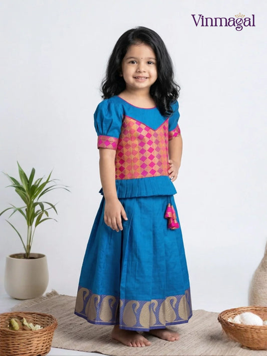Pink and peacock blue pure silk pavadai set for girls with silver zari skirt and peplum top