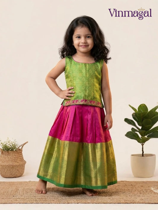 pink and green silk pavadai set for kids with sleeveless blouse and flared skirt
