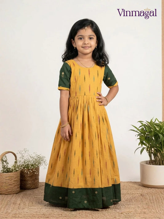 yellow and green ikkat cotton long gown for kids featuring traditional handwoven pattern