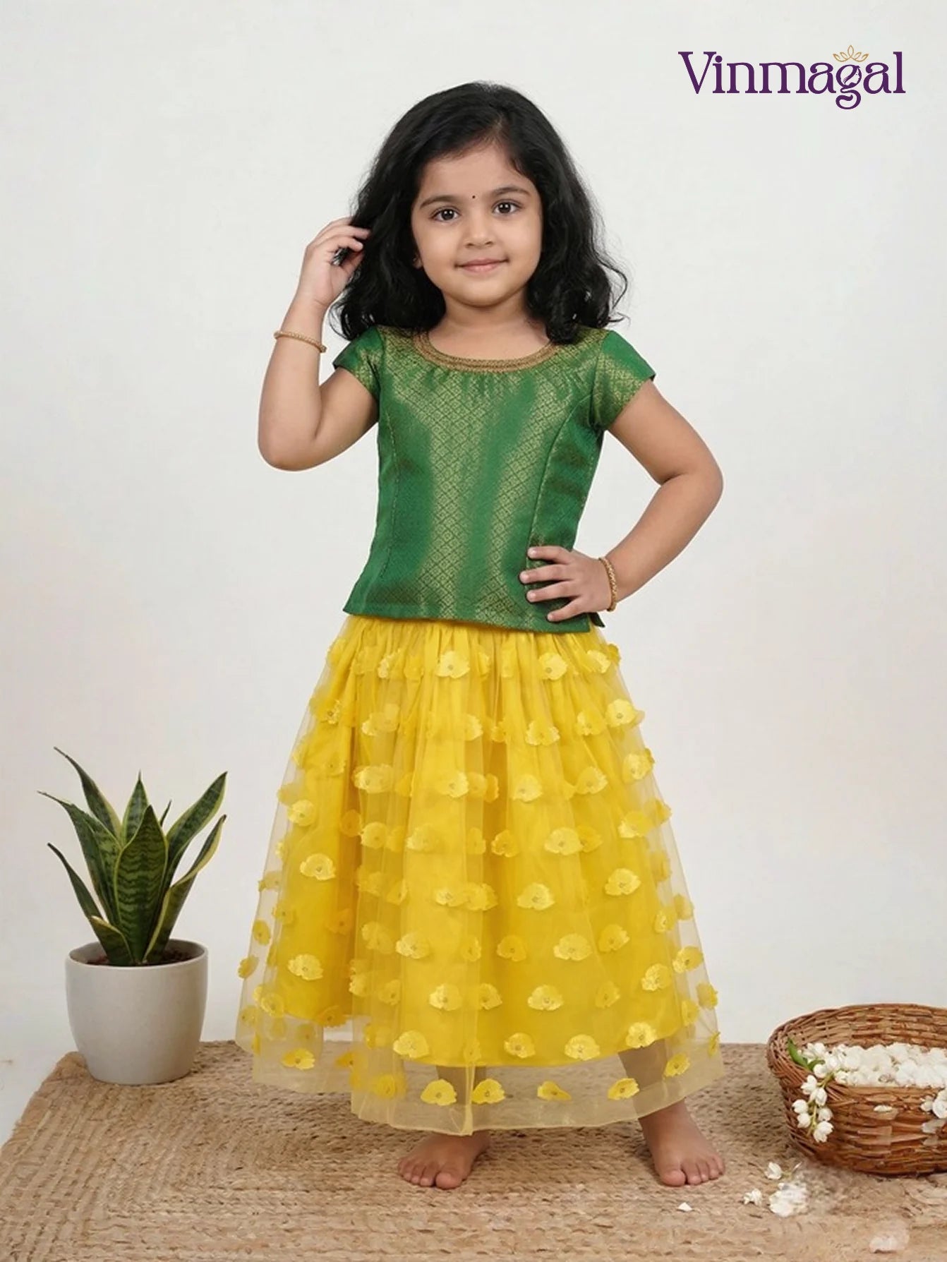 yellow netted langa with green brocade top for girls in fancy ethnic skirt set