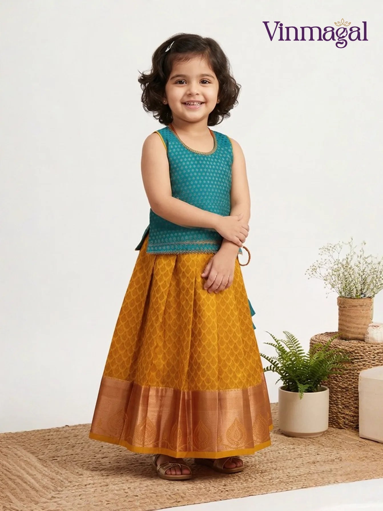 yellow and rama green silk pavadai for kids with zari peacock border design